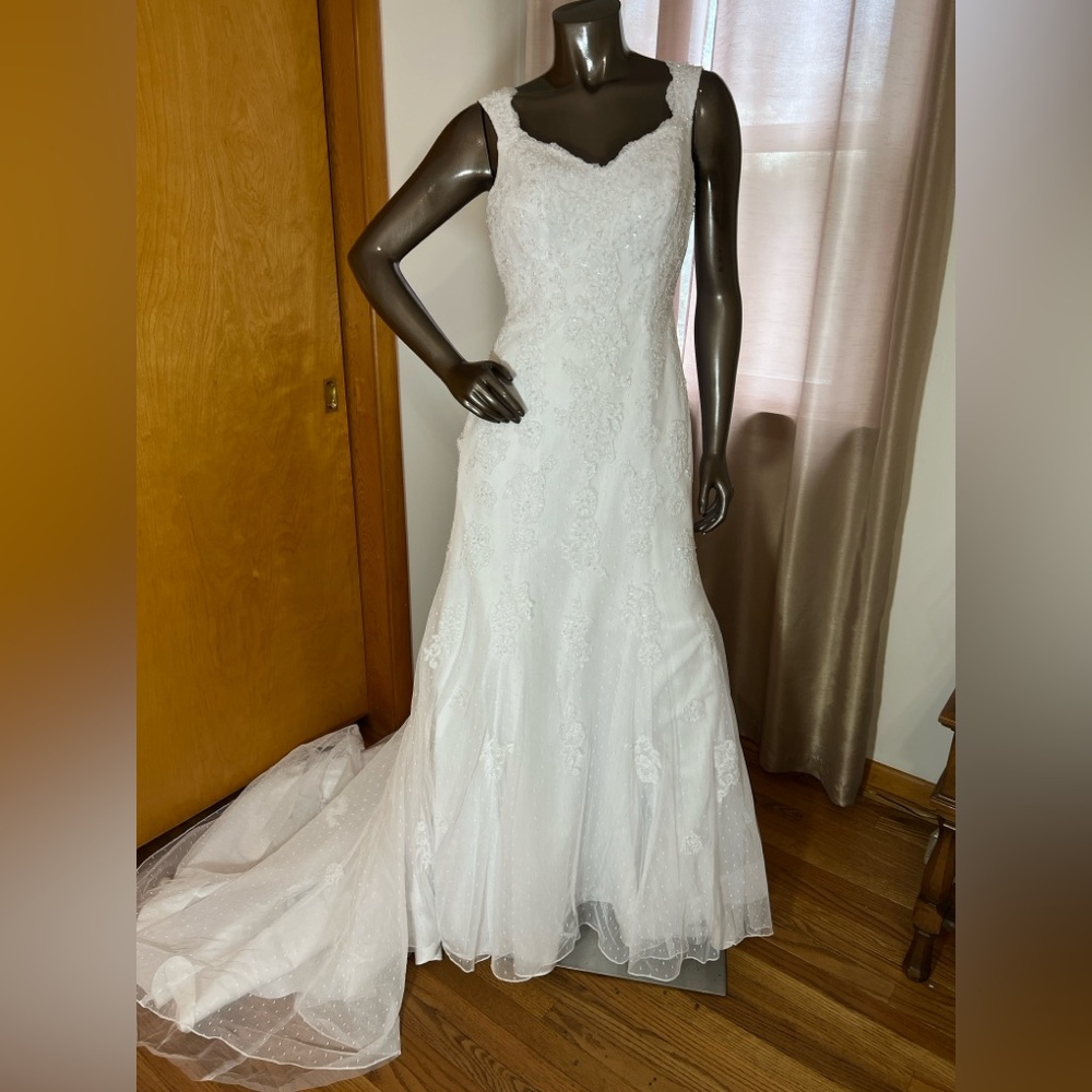 David’s Bridal style V3644 white wedding gown with trumpet style tulle skirt.